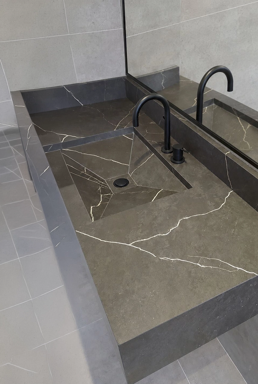 X4 Design and Build bathroom countertop installation with dark marble basins, black faucets, wall tile finish, and modern wash basin construction detail