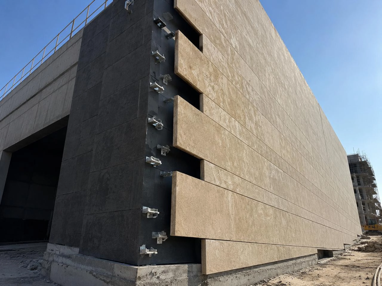 Natural stone cladding and wall finishing for villas by X4 Design and Build