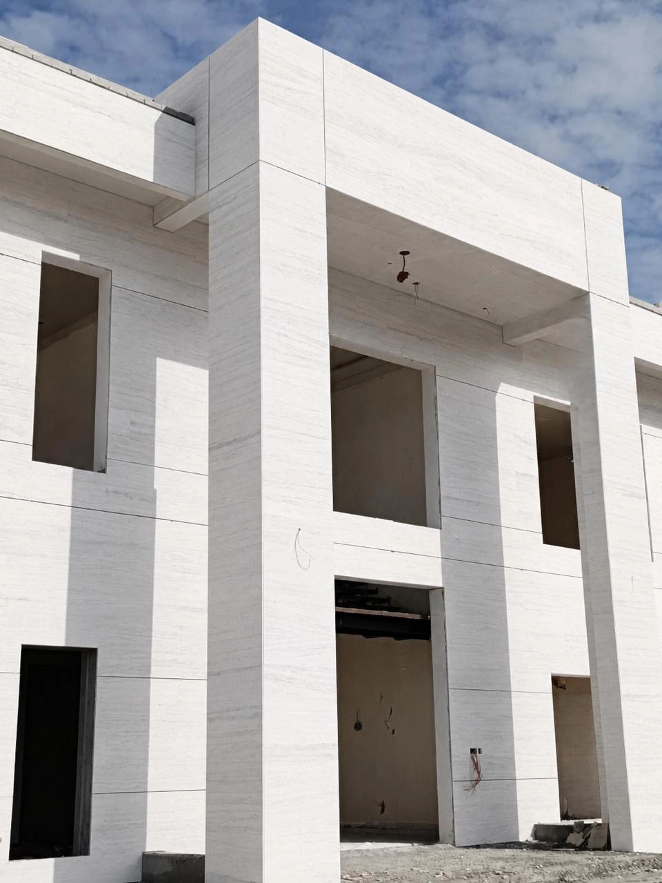 Natural stone cladding and wall finishing by X4 Design and Build